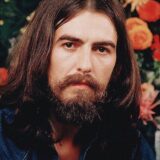 George Harrison is best remembered for his introspective lyrics, spiritual journey, and quiet strength within The Beatles. But among his many hidden passions, one of the most gentle and surprising was his love for watercolor painting. It wasn’t a public performance or a commercial endeavor. George painted because it gave him peace. In his downtime—especially in the 1980s and 1990s—he would often retreat to his garden at Friar Park, brush in hand, capturing the colors of his flowers, trees, and koi ponds on paper. His technique wasn’t academic. He didn’t seek perfection or praise. His watercolors were personal—impressionistic, loose, and full of feeling. Friends described watching him paint as watching meditation in motion. He’d lose track of time, letting the colors flow softly across the page. George once said that painting was a way to “see silence.” That line has stuck with me as a fan. It makes sense coming from the Beatle who was always listening more than speaking, who found comfort in spiritual stillness rather than spotlight. Though very few of George’s paintings have ever been exhibited publicly, a handful have been shown in retrospectives with his handwritten lyrics, blending his visual and musical sensibilities. The paintings, like his music, were layered with patience and purpose. For those who admired him beyond the guitar, knowing George painted with watercolors only deepens the sense of his soul: soft, sincere, and always quietly searching for meaning in every shade:::